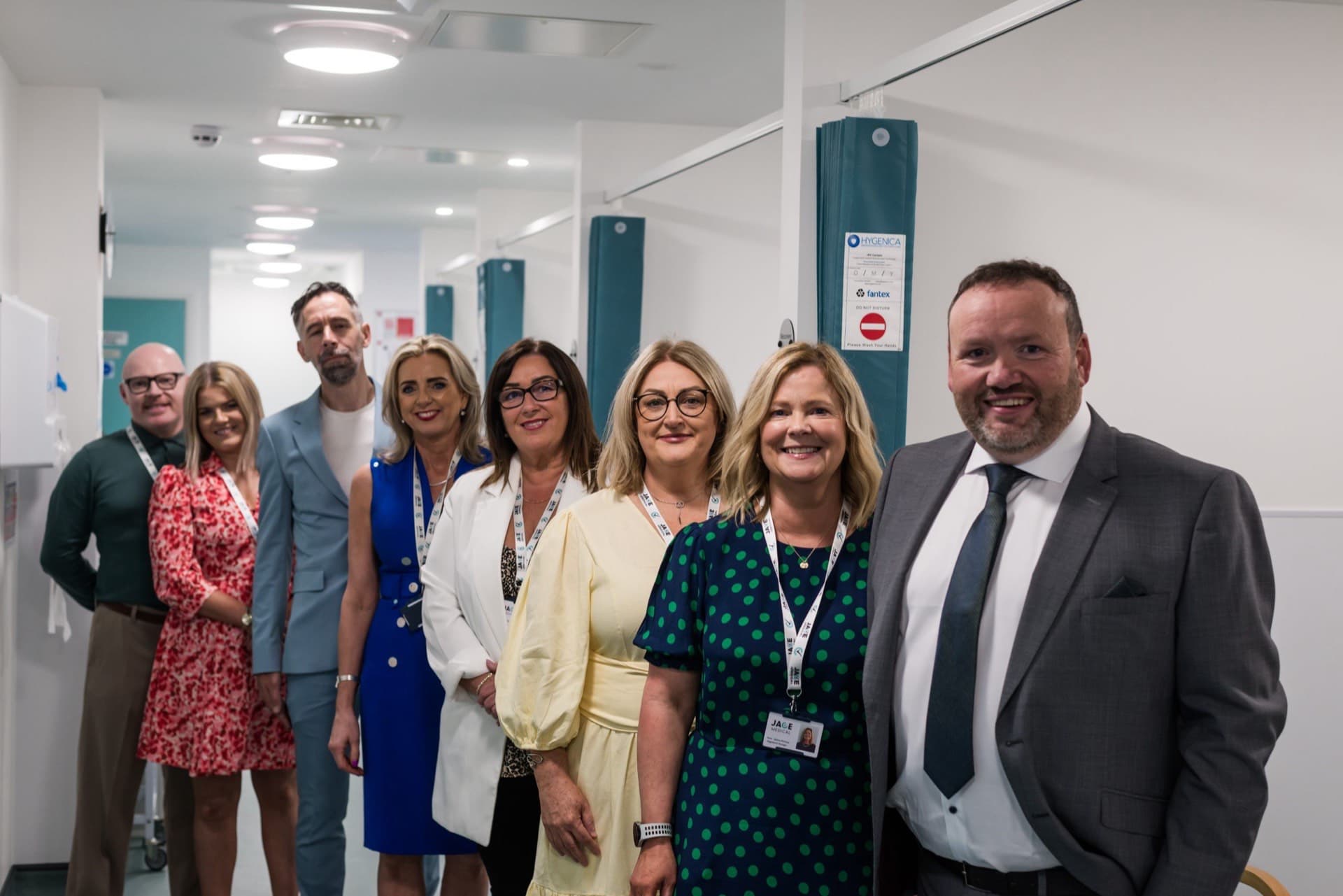 Members of the JACE Private Hospital team standing together in the hospital corridor